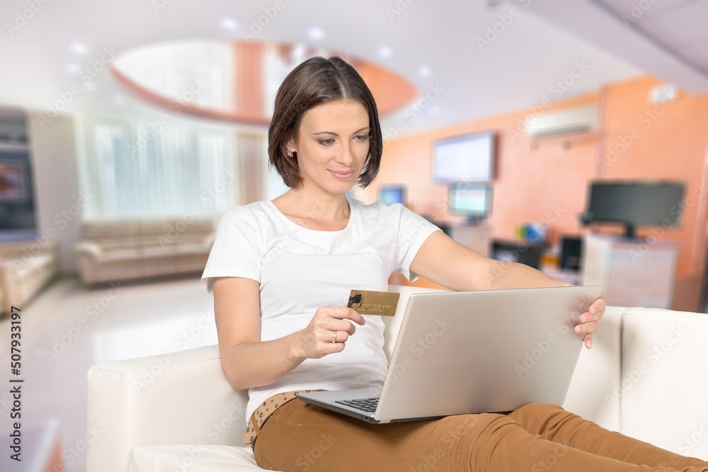 Beautiful women holds credit card. Online shopping and excited with success payment concept Beautiful women holds credit card. Online shopping and excited with success payment concept