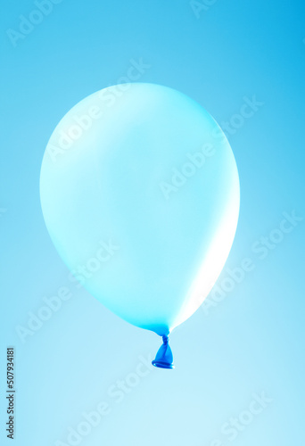 An image of a balloon on a blue background.
