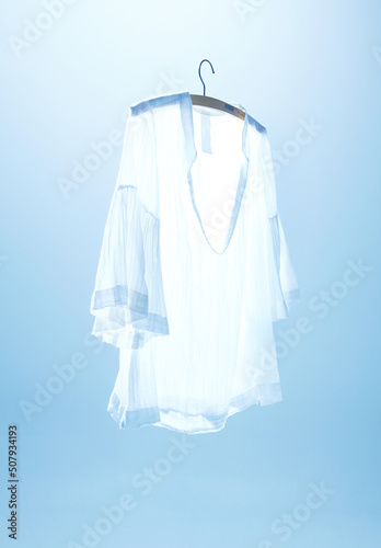 Image of a summer shirt on a blue background. 