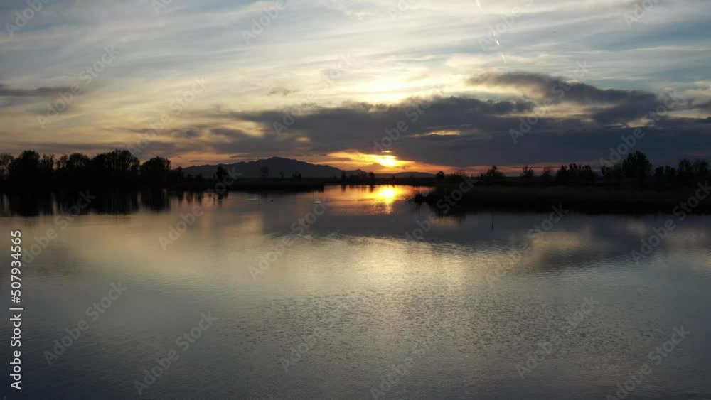 Drone Aerial Flying Left Above Lake Surface at Sunset Drone Aerial Flying Left Above Lake Surface at Sunset