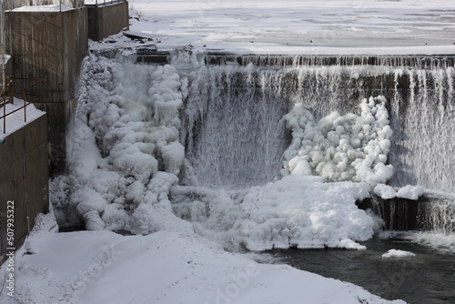 snowy and icy white winter waterfall