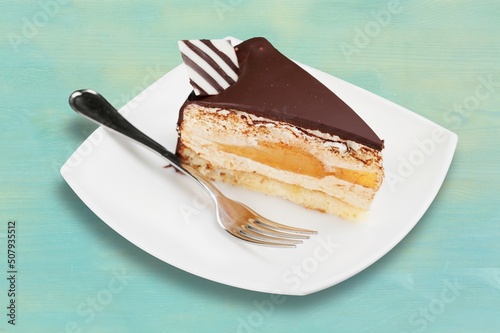 Appetizing creams cake on  with sugar powder on plate. photo