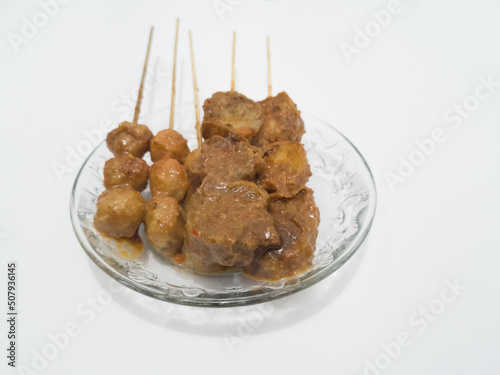 Snacks made from flour and other ingredients are called spicy cilok