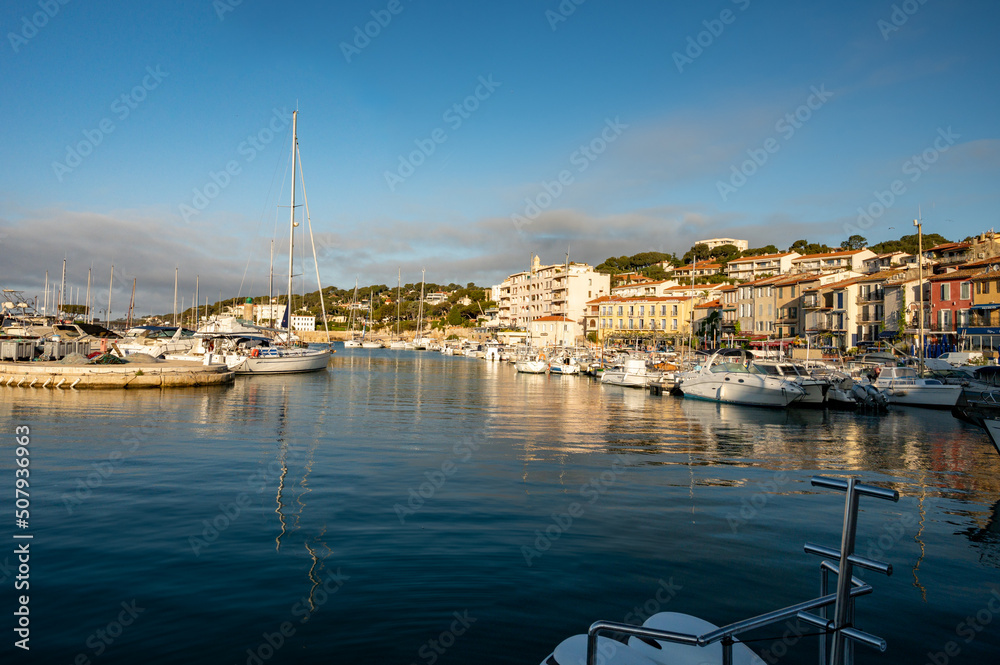 Sunny day in South of France, view on old fisherman's port with boats and colorful buildings in Cassis, Provence, France