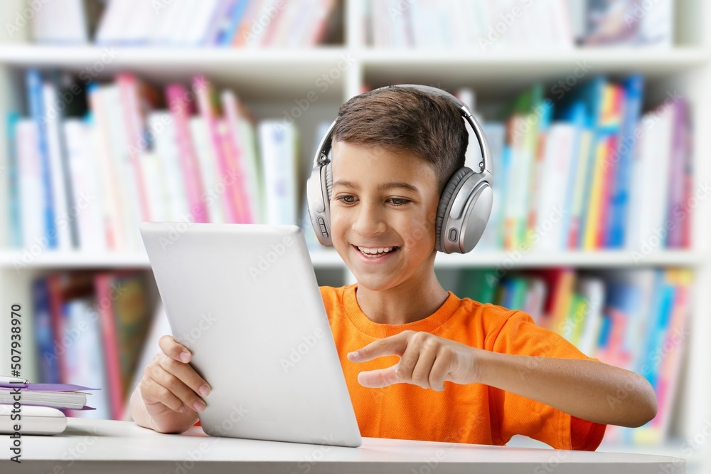 Child studying via internet online with pc, taking network video lessons at home Child studying via internet online with pc, taking network video lessons at home