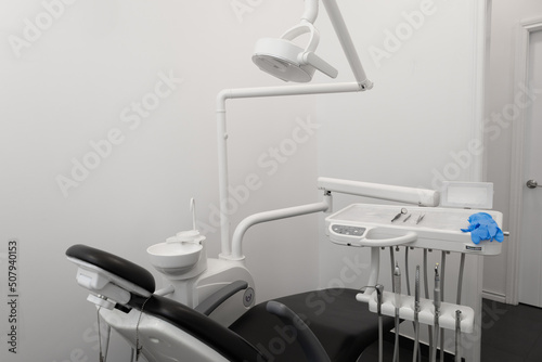 modern dental office, professional objects in workplace such as: dentist chair, tools, interior decoration photo