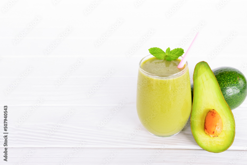 Avocado fresh cocktail vanilla smoothies fruit juice beverage healthy the taste yummy in glass drink episode good morning on wooden background. Avocado fresh cocktail vanilla smoothies fruit juice beverage healthy the taste yummy in glass drink episode good morning on wooden background.