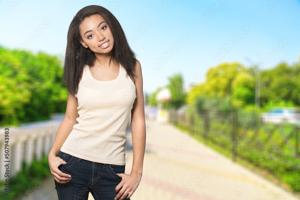 Beautiful relaxed happy woman on a outdoor background