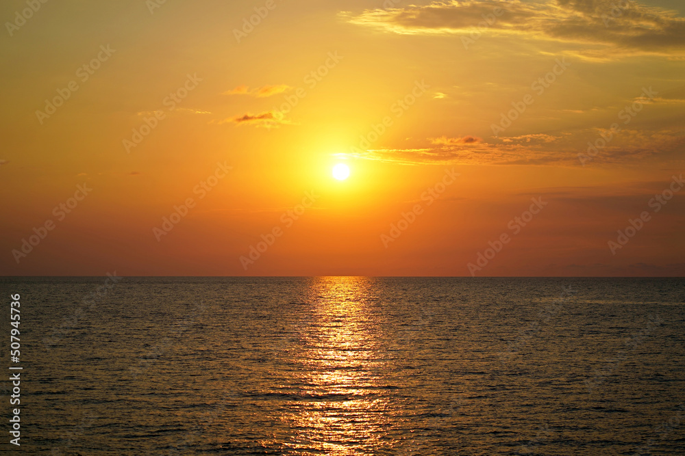 Beautiful colorful sunset over wavy waters of Black sea in Crimea on summer day. Natural landscape background and wallpaper Beautiful colorful sunset over wavy waters of Black sea in Crimea on summer day. Natural landscape background and wallpaper