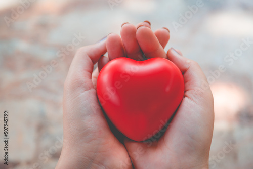 Woman hold red heart