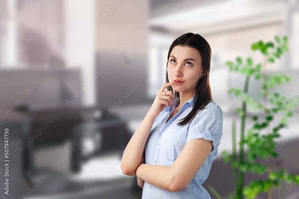 Peaceful thoughtful young woman in casual looking at window away Peaceful thoughtful young woman in casual looking at window away
