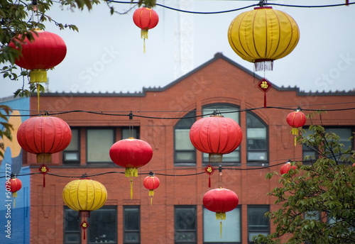 Red and yellow lanterns hanging over Fisgard - 1 photo