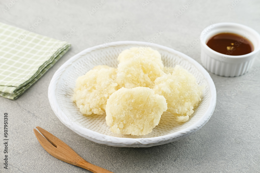 Cireng, a savory snack from West Java, Indonesia, made from tapioca flour and deep-fried, served with a spicy sauce.
Cireng, a savory snack from West Java, Indonesia, made from tapioca flour and deep-fried, served with a spicy sauce.