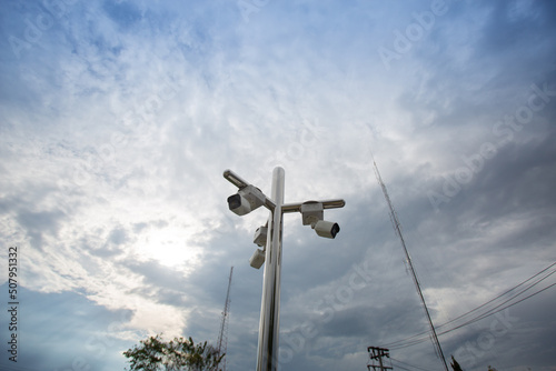 Surveillance cameras are mounted on stainless steel poles to provide security in places such as in the city. is a broad perspective