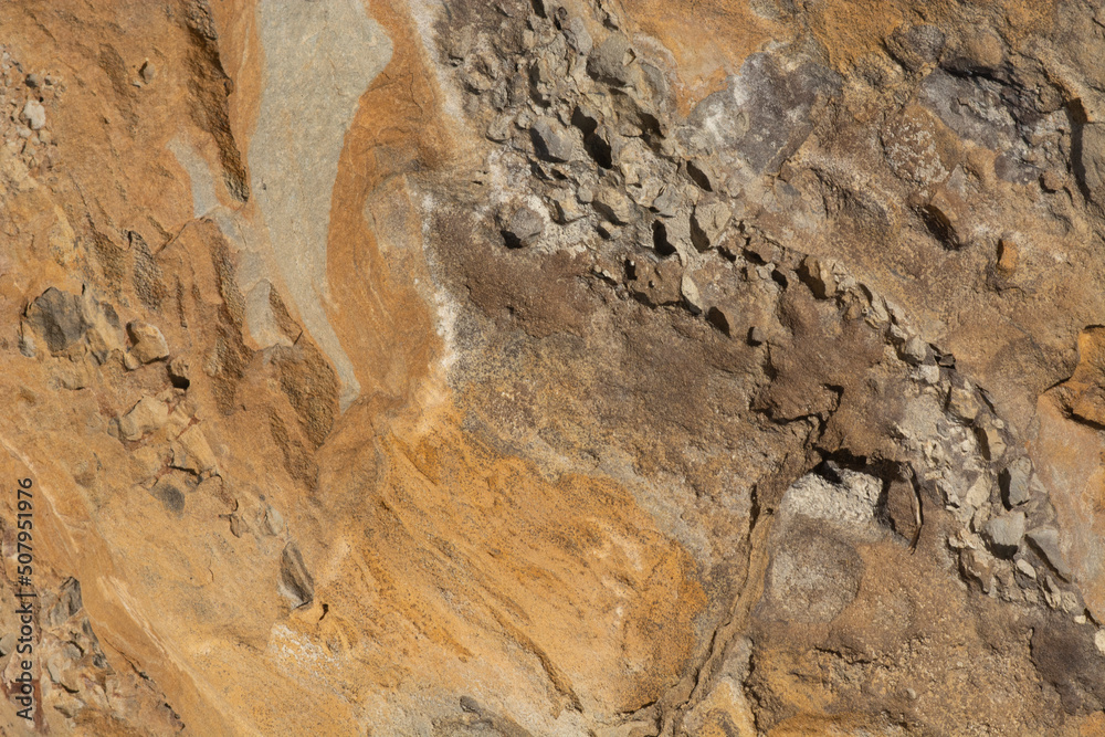 Closeup of yellowish textured Colorado rock with erosion from water and wind Closeup of yellowish textured Colorado rock with erosion from water and wind