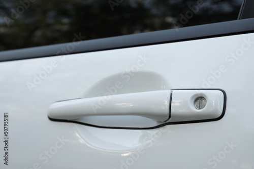 Closeup view of car door with handle