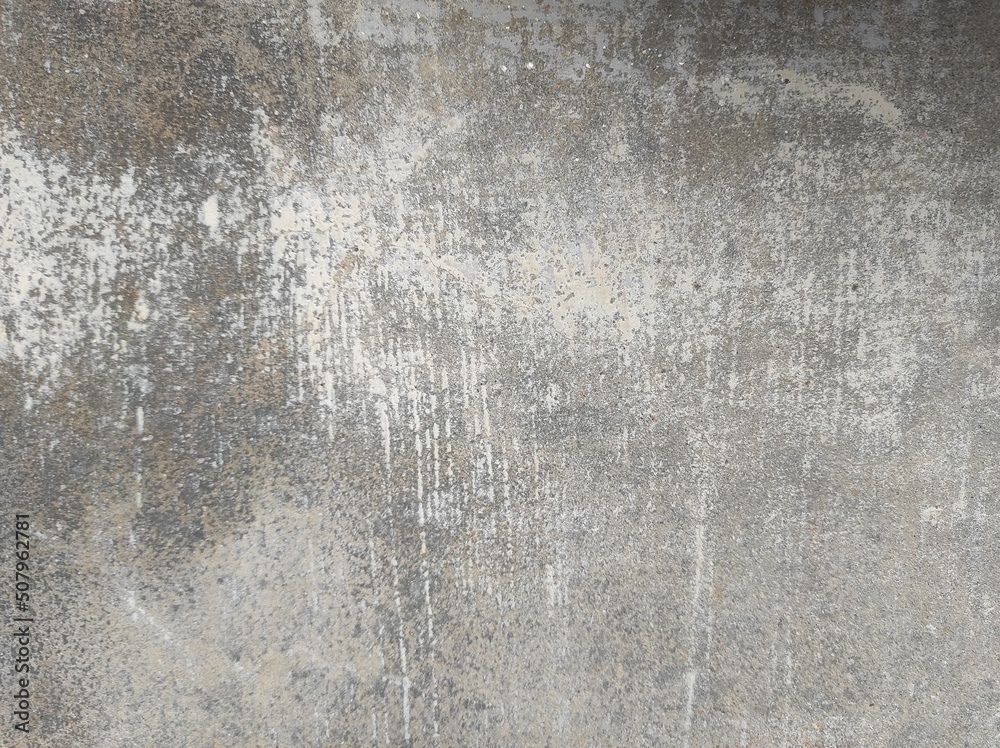Fototapeta premium Texture of old concrete wall.Concrete wall of light grey color cement texture background.Grey pastel rough crack cement texture stone concrete,rock plastered stucco wall; painted flat fade background.