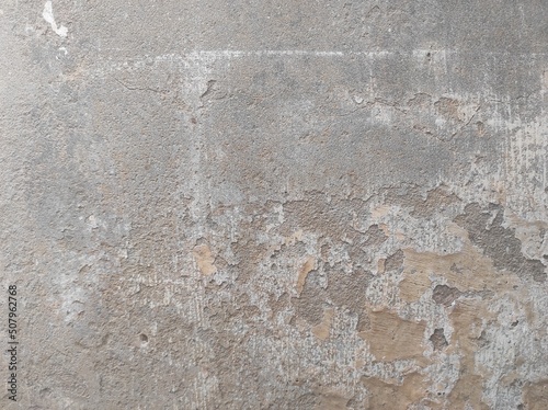 Texture of old concrete wall.Concrete wall of light grey color cement texture background.Grey pastel rough crack cement texture stone concrete,rock plastered stucco wall  painted flat fade background. © prateek