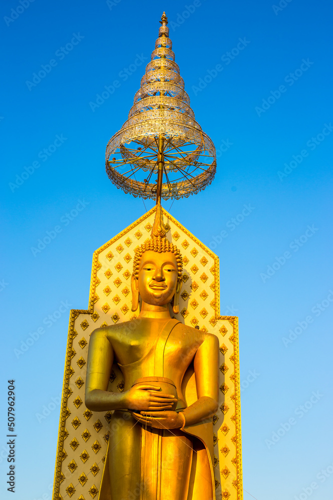 Fototapeta premium The background of religious attractions in Phitsanulok Province (Wat Chan Tawan Tok) has a distinctive golden yellow sculpture, close to the Nan River, tourists always come to make merit in Thailand