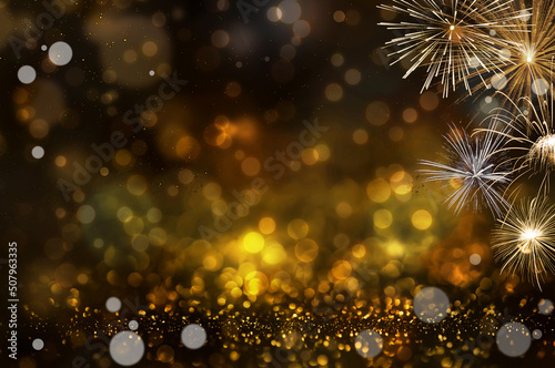 Abstract golden glitter and bokeh light background. with fireworks