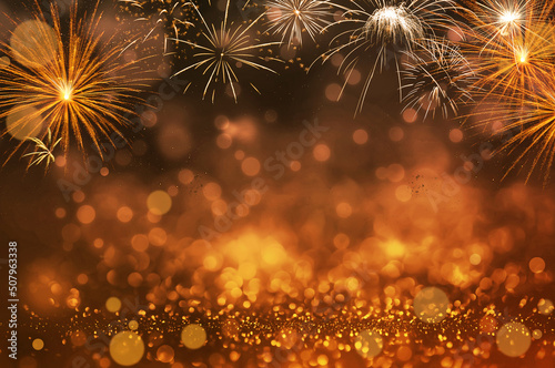 Red glitter and bokeh background with fireworks.