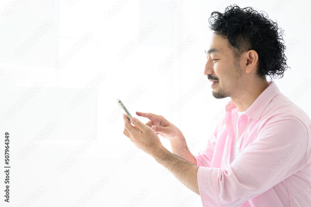 A man with an image of a tap on his phone A man with an image of a tap on his phone