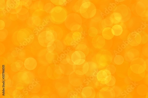 Festive yellow luminous background. Bokeh blur background.