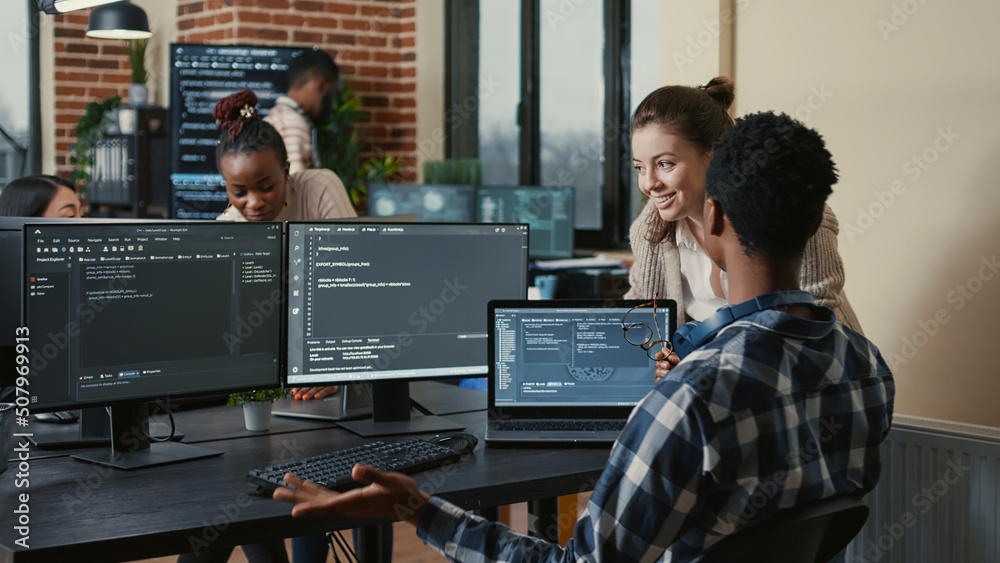 Software developers celebrating successful code compiling doing high ...
