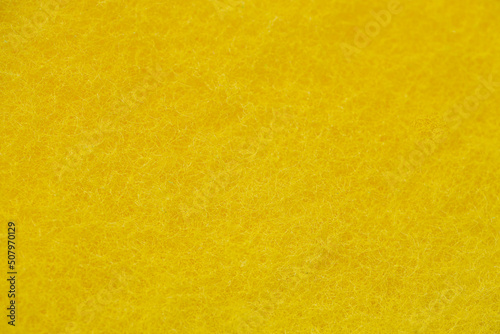 Yellow sponge texture closeup view.