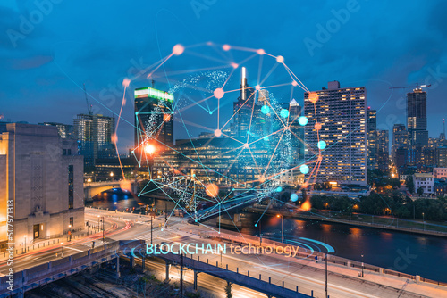 Aerial panoramic cityscape of Philadelphia financial downtown at summer night time, Pennsylvania, USA. Decentralized economy. Blockchain, cryptocurrency and cryptography concept, hologram
