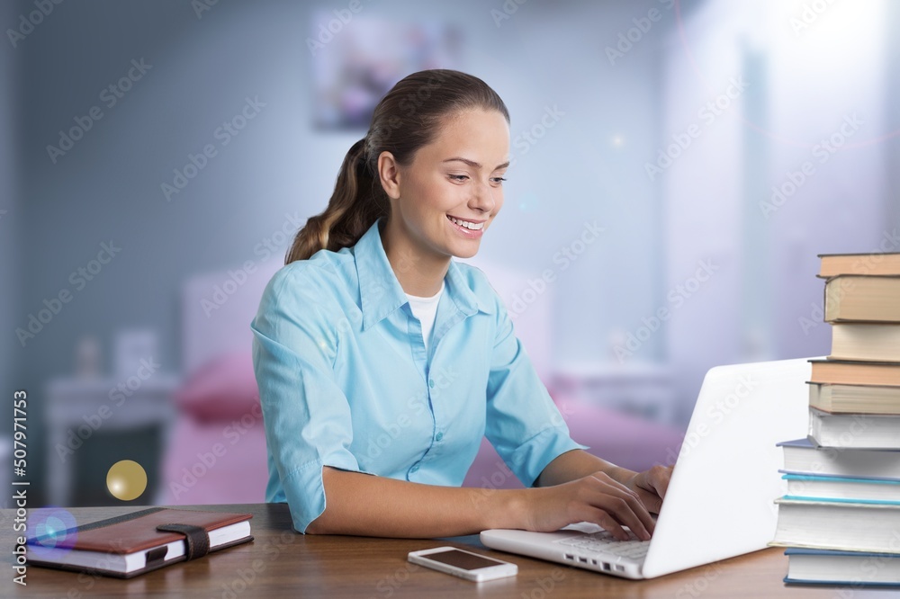 Cheerful laughing young woman tutor freelancer student e-learning, working remotely, watching webinar on laptop Cheerful laughing young woman tutor freelancer student e-learning, working remotely, watching webinar on laptop