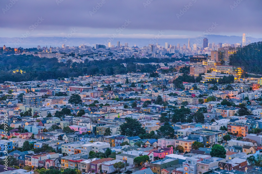 San Francisco, California, USA - October 5, 2021, Evening view of the city from the top of San Francisco's Grandview Park next to the 16th Avenue tiled steps. Photo edited in pastel colors.