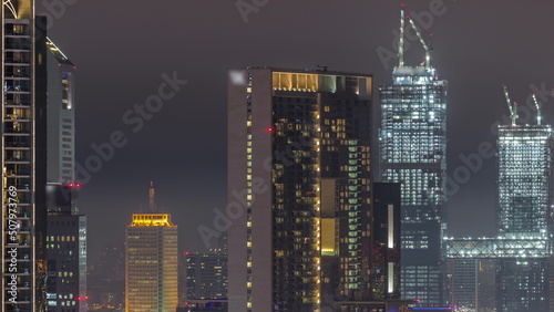 Aerial view of Dubai International Financial Centre district night timelapse