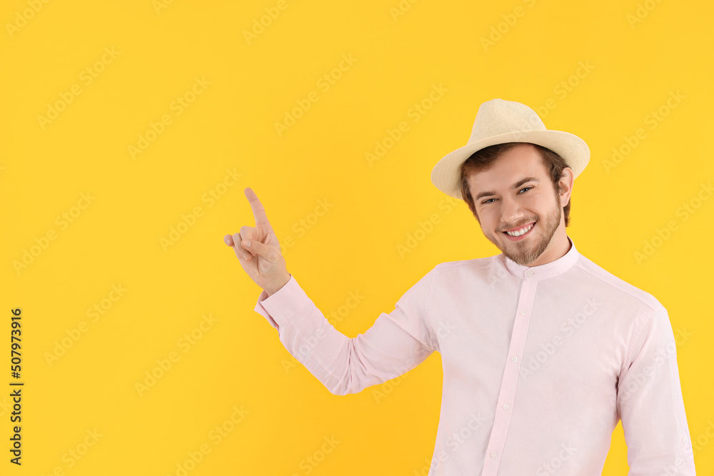 Concept of people, young man on yellow background