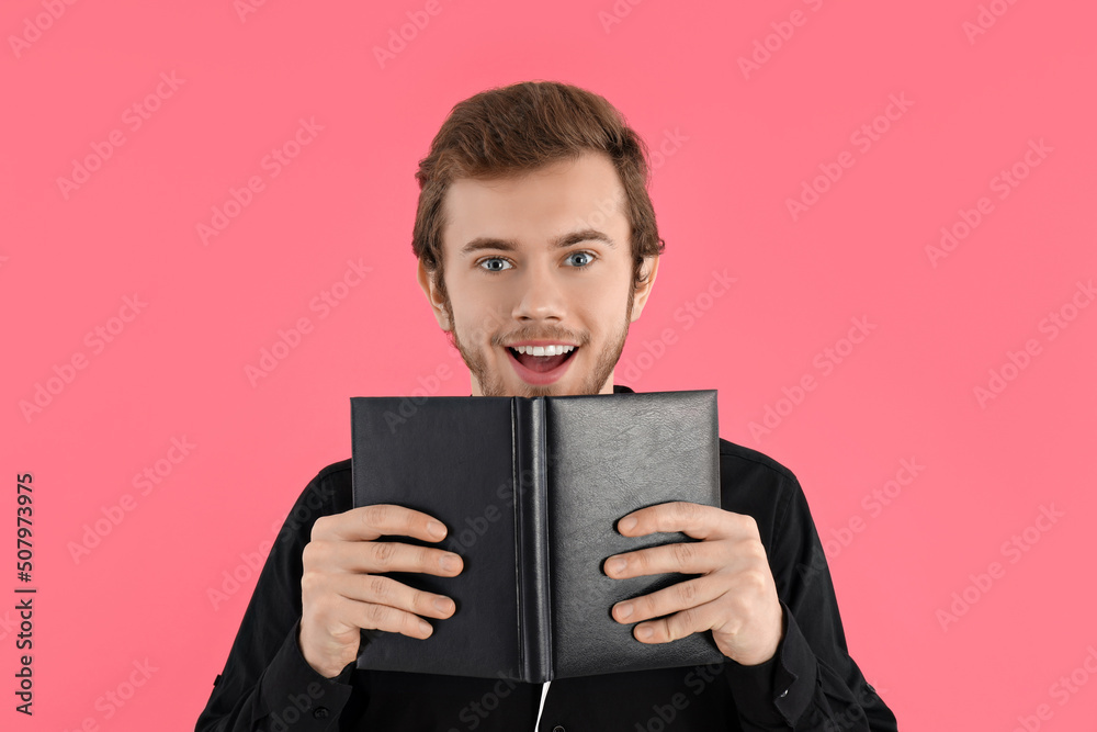 Concept of people, young man on pink background Concept of people, young man on pink background