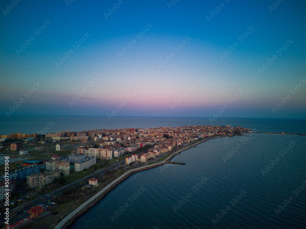 View from a height above the town of Pomorie with houses and streets washed by the Black Sea in Bulgaria