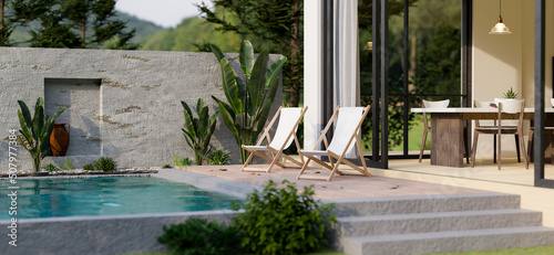 Modern home with swimming pool or Luxury private pool villa outdoor design with beach chairs © bongkarn