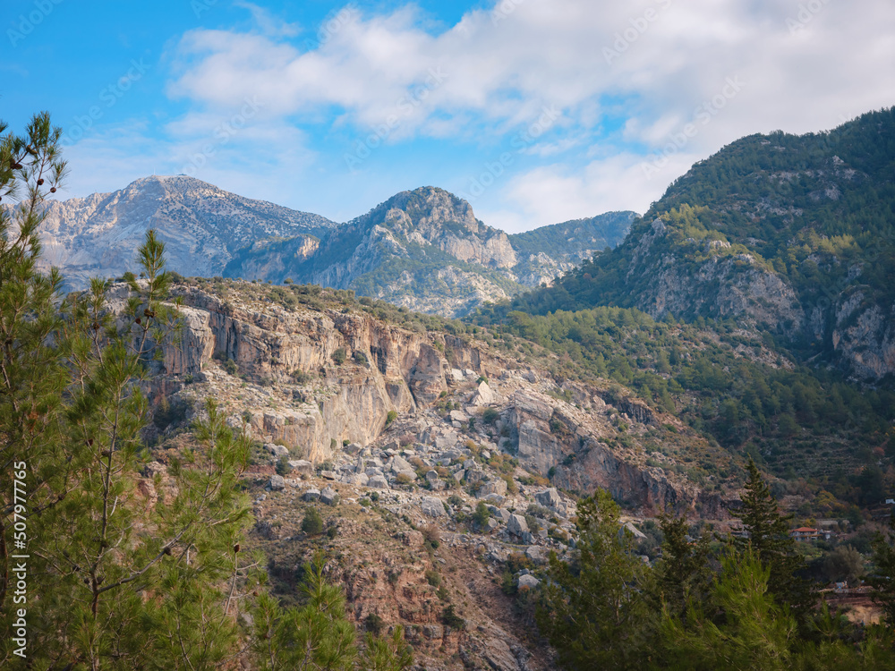 Butterfly Valley (kelebekler vadisi) in city of Oludeniz Fethiye in western Turkey. walk along famous Lycian Way, view of Mount Babadag Butterfly Valley (kelebekler vadisi) in city of Oludeniz Fethiye in western Turkey. walk along famous Lycian Way, view of Mount Babadag
