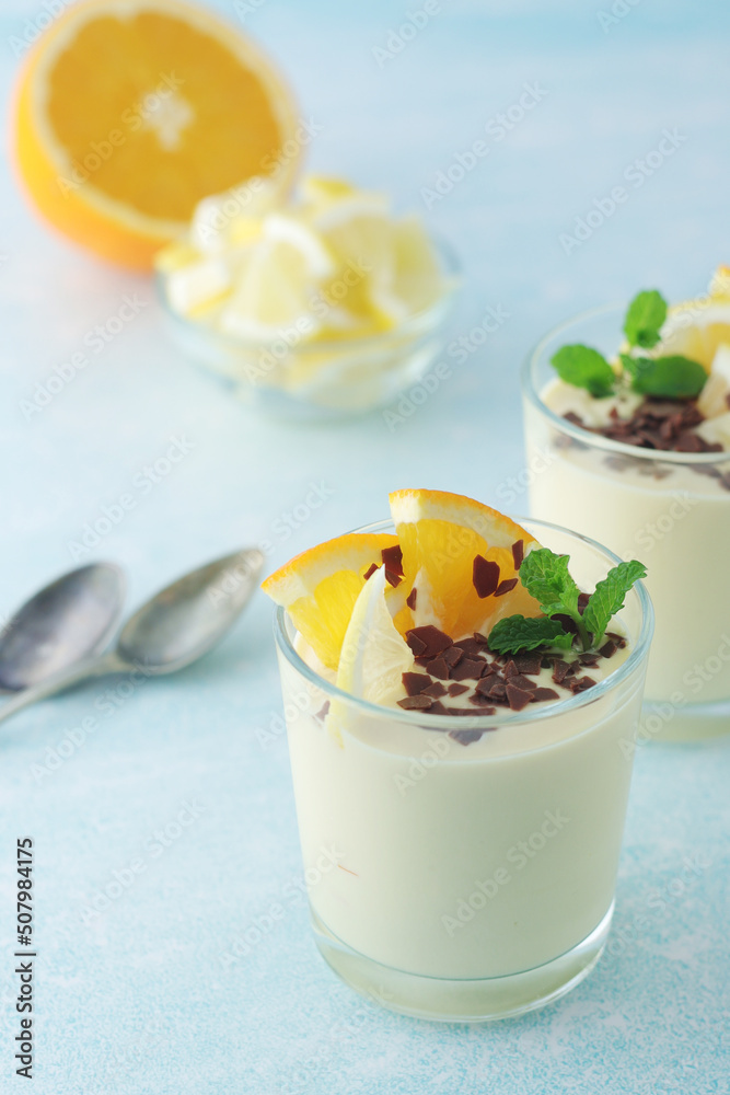 Orange lemon citrus milk mousse in glasses Orange lemon citrus milk mousse in glasses