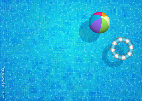 Swimming pool background with beach ball and rubber ring