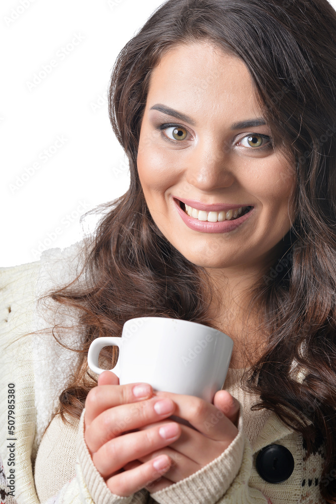 Portrait of beautiful curly woman wearing warm clothing holding cup isolated Portrait of beautiful curly woman wearing warm clothing holding cup isolated