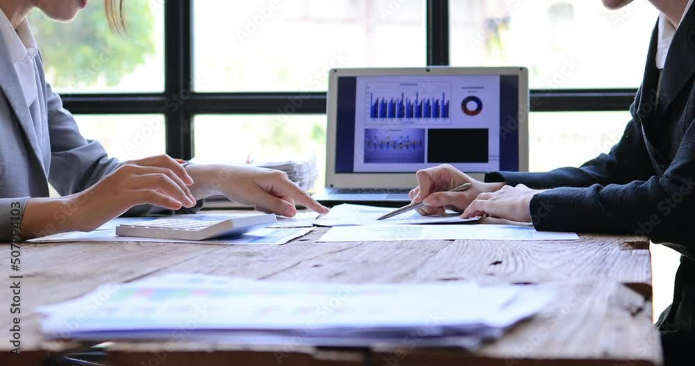 4k video footage of a group of young Business people discuss investment project working on Statistical analysis and accounting of annual financial data of enterprises