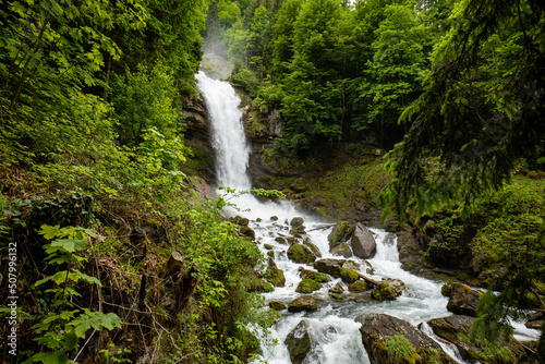Beautifull large waterfall in the Swiss Alps. Sunny summer day  green nature  no people
