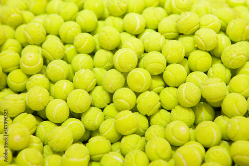 Candy sweets jelly. Close up view of delicious sweet candies in form of tennis balls. Fruit jelly in shop window. Sweets for Easter, Halloween. Unhealthy or organic food. Selective focus. Top view  © Liudmyla