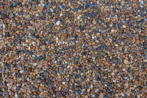 Brown gravel textured background. Abstract nature rock pattern surface concept.