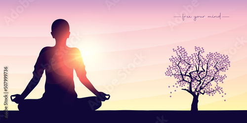 peaceful yoga mediating person on sunny bright background with big tree