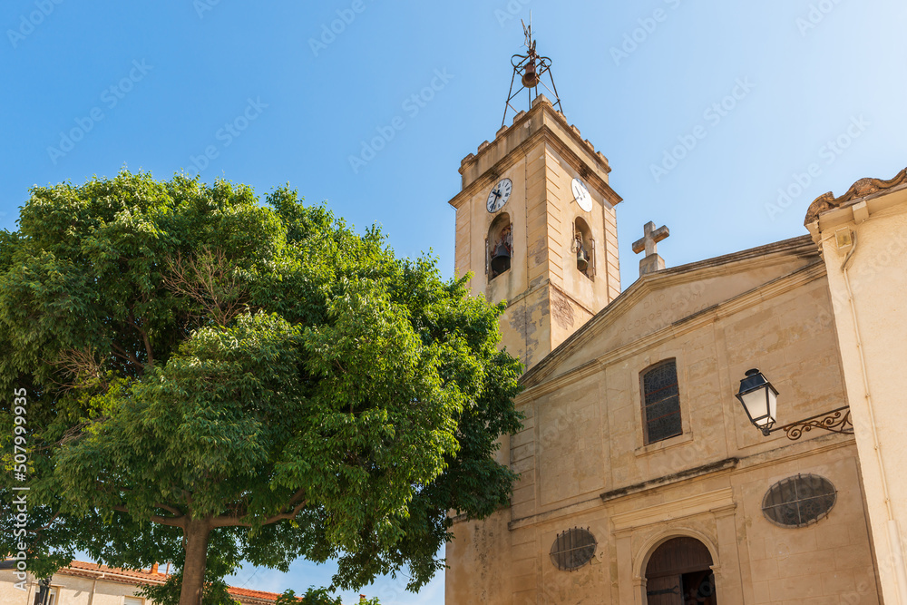 Church and bell tower of the small village of Bouzigues on the Etang de Thau, in Herault, Occitanie, France