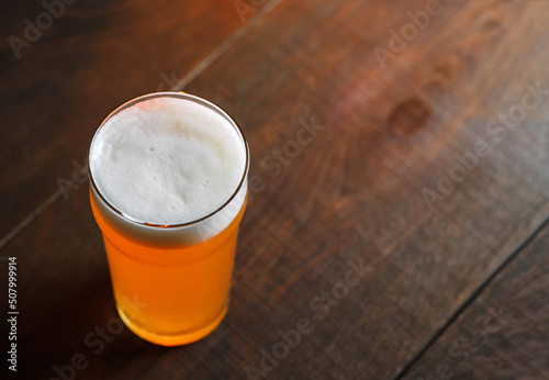 Платно glass of craft beer indian pale ale on a wooden table, copy space