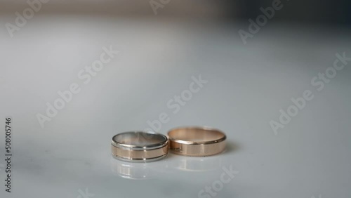 Wedding rings with beautiful light of a happy young couple