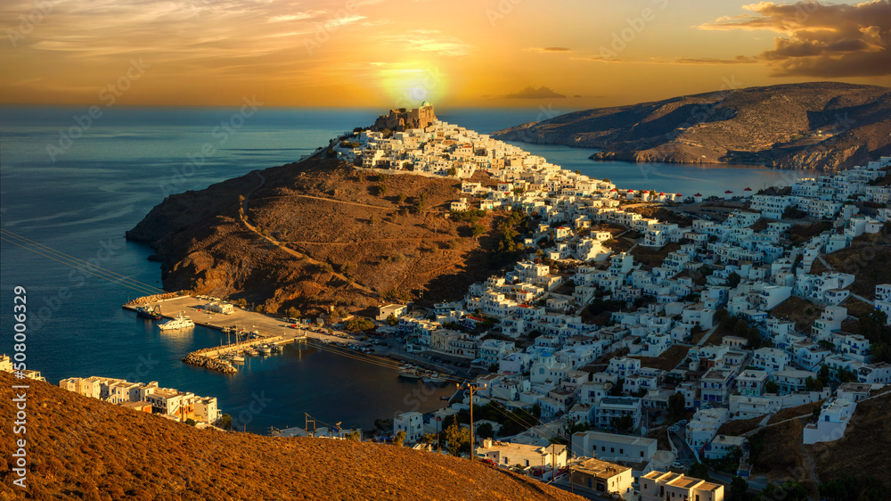 Stunning mediterranean sunset scenery. Beautiful Astypalea (Astypalaia) island, view of Chora village and castle.  Dodecanese, Greece travel
